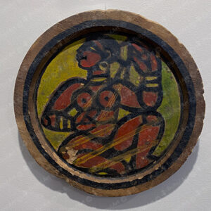 Seated Woman on a Wooden Plate